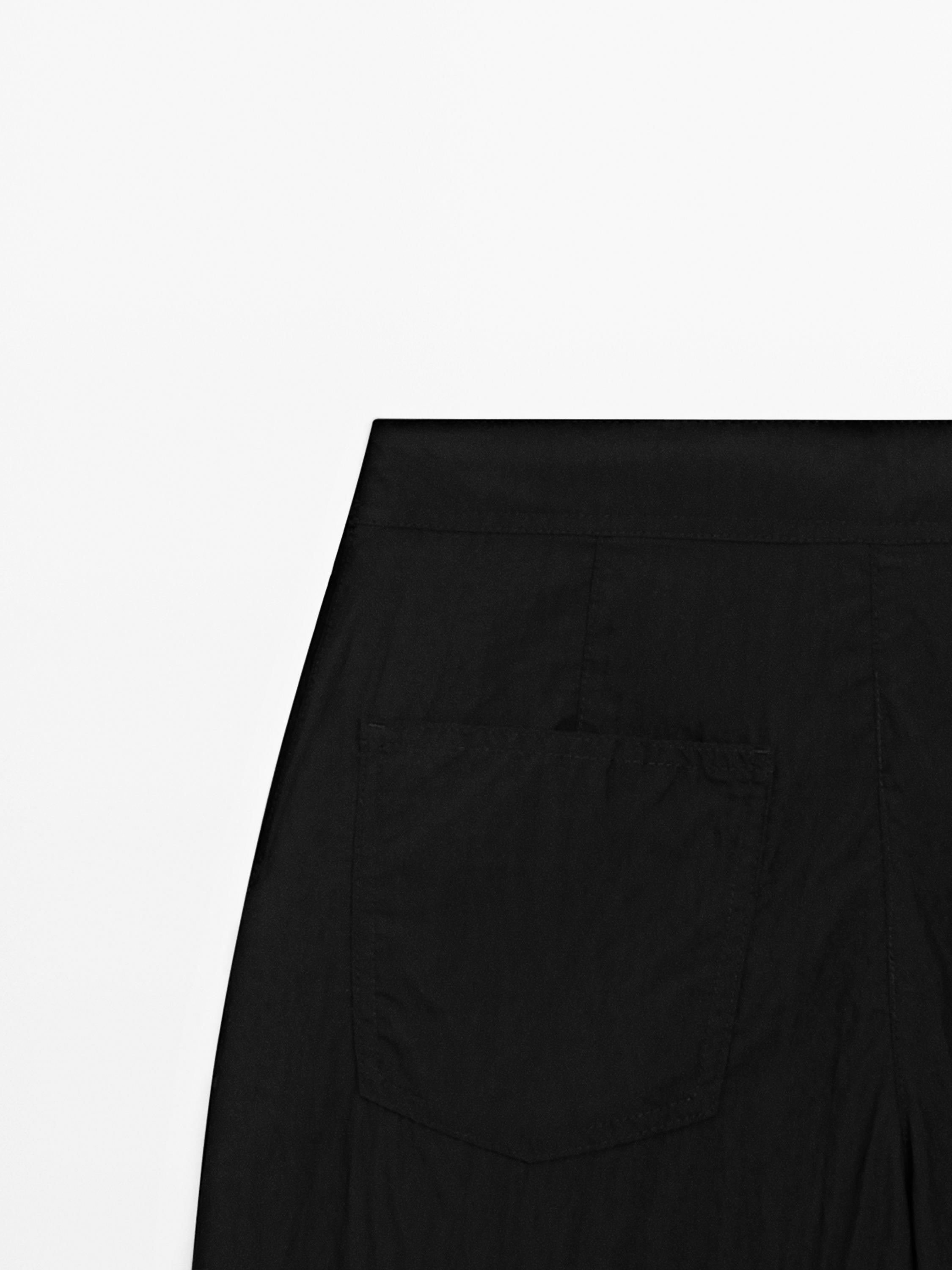 Flowing palazzo trousers with darts